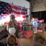 Scouts running the cotton candy machine